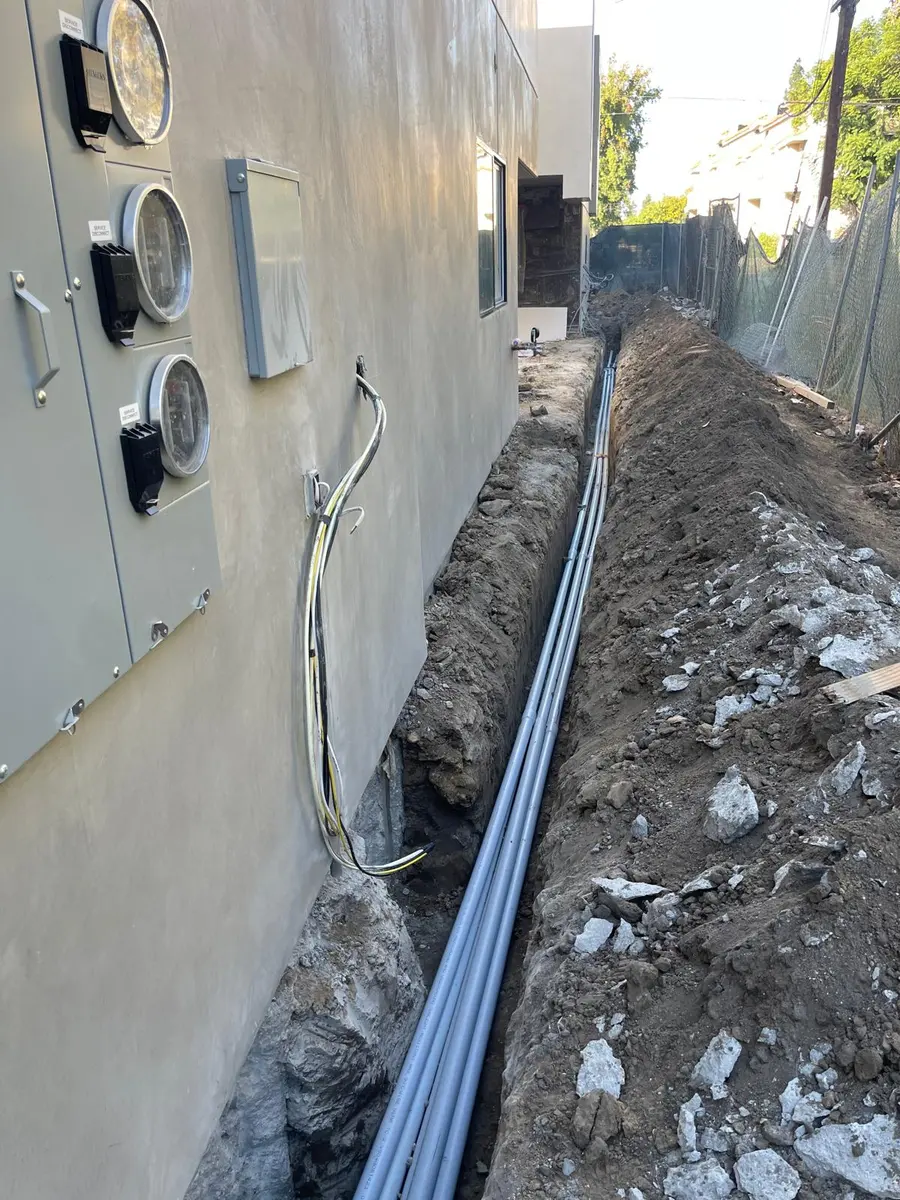 Multi-meter service stack and underground conduit run — LADWP-coordinated panel upgrade in Los Angeles